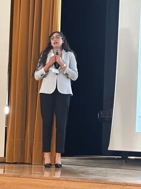 Mahnaz speaking on stage